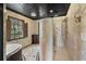 Unique bathroom with a tiled ceiling, modern shower, and separate tub at 5366 N Lake Farms Rd, De Leon Springs, FL 32130