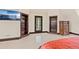 Bedroom with a flatscreen TV, ensuite bathroom and built-in shelving at 5366 N Lake Farms Rd, De Leon Springs, FL 32130