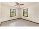 Cozy bedroom features two windows with beautiful natural light and tile flooring at 5366 N Lake Farms Rd, De Leon Springs, FL 32130
