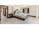 Bedroom boasts detailed trim, a window with dark shutters, and a decorative area rug at 5366 N Lake Farms Rd, De Leon Springs, FL 32130