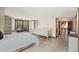 Bright bedroom with a window seat, built-in shelves, and a bed at 5366 N Lake Farms Rd, De Leon Springs, FL 32130