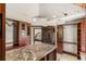 Custom closet with built-in storage, granite countertops, and decorative lighting at 5366 N Lake Farms Rd, De Leon Springs, FL 32130