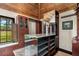 Walk-in closet with custom wood storage, granite countertops, and bright natural light at 5366 N Lake Farms Rd, De Leon Springs, FL 32130