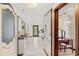 Bright dressing room featuring vanities, mirrors, and a door to the outside at 5366 N Lake Farms Rd, De Leon Springs, FL 32130