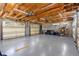Spacious four-car garage offers ample storage and features an epoxy floor at 5366 N Lake Farms Rd, De Leon Springs, FL 32130