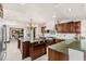 Bright kitchen featuring custom cabinets, granite countertops, and stainless steel appliances at 5366 N Lake Farms Rd, De Leon Springs, FL 32130