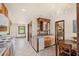 Kitchen with an island and a wine rack, plus an adjacent dining area at 5366 N Lake Farms Rd, De Leon Springs, FL 32130
