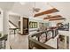 Bright upper-level space with wooden beams, large windows, railing and open floor plan at 5366 N Lake Farms Rd, De Leon Springs, FL 32130