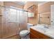 Bathroom featuring a single sink, medicine cabinet and sliding glass doors to the shower/tub combo at 558 Tulane Dr, Altamonte Springs, FL 32714
