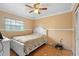 Bright bedroom featuring a ceiling fan, neutral walls, and a window for natural light at 558 Tulane Dr, Altamonte Springs, FL 32714