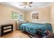 Bedroom featuring a single bed, parquet floors and large window at 558 Tulane Dr, Altamonte Springs, FL 32714