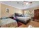 Bedroom featuring two beds, ceiling fan, large window and parquet floors at 558 Tulane Dr, Altamonte Springs, FL 32714