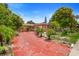 Single-story house with a red-paved driveway and mature trees at 558 Tulane Dr, Altamonte Springs, FL 32714