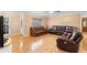 Spacious living room featuring tile floors and leather furniture at 558 Tulane Dr, Altamonte Springs, FL 32714