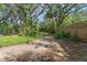 View of large yard, privacy fence, and extensive landscaping at 5635 Burts Park Rd, De Leon Springs, FL 32130