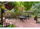 Enjoy this backyard deck with an umbrella and covered grilling station, perfect for outdoor entertaining at 5635 Burts Park Rd, De Leon Springs, FL 32130