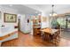 View of the dining room adjacent to the kitchen and screened-in patio at 5635 Burts Park Rd, De Leon Springs, FL 32130