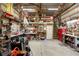 Large garage with extensive workbench area, upper level storage and easy access door at 5635 Burts Park Rd, De Leon Springs, FL 32130
