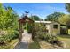 View of backyard showing garden shed and arbor at 5635 Burts Park Rd, De Leon Springs, FL 32130