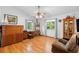 Bright living room featuring hardwood floors, white walls, and natural light at 5635 Burts Park Rd, De Leon Springs, FL 32130