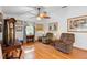 Bright living room with hardwood floors, a ceiling fan, and a relaxing atmosphere at 5635 Burts Park Rd, De Leon Springs, FL 32130