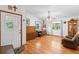 Bright living room featuring hardwood floors, white walls, and natural light at 5635 Burts Park Rd, De Leon Springs, FL 32130