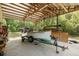 Boat storage and workshop area with a boat on a trailer and plenty of room for tools and equipment at 5635 Burts Park Rd, De Leon Springs, FL 32130