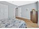 Bedroom featuring wood-look flooring, closet doors and dresser at 600 N Boundary Ave # 118B, Deland, FL 32720