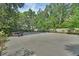 Spacious common area with picnic tables and mature trees providing ample shade at 600 N Boundary Ave # 118B, Deland, FL 32720