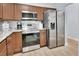 Kitchen featuring stainless steel appliances, granite countertops, and wood flooring at 600 N Boundary Ave # 118B, Deland, FL 32720