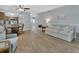 Spacious living room featuring hardwood floors, a cozy sofa, and an open layout, perfect for relaxation and socializing at 600 N Boundary Ave # 118B, Deland, FL 32720