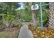 Path to 'Friendship Park' sign amidst the lush foliage and shady trees at 600 N Boundary Ave # 118B, Deland, FL 32720