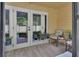 Charming outdoor patio with tile flooring and comfortable seating perfect for relaxation at 600 N Boundary Ave # 118B, Deland, FL 32720