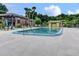 Community pool with lounge chairs and lush greenery surrounding the refreshing water at 600 N Boundary Ave # 118B, Deland, FL 32720