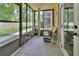 Relaxing sunroom with glass panels, tiled floor, and comfortable seating at 600 N Boundary Ave # 118B, Deland, FL 32720