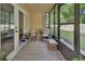 Inviting sunroom with tiled floor, comfortable seating, and views of the outdoors at 600 N Boundary Ave # 118B, Deland, FL 32720