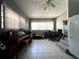 Versatile bonus room featuring tiled flooring, abundant natural light, and space for multiple uses at 601 Berkshire Rd, Daytona Beach, FL 32114