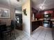 Open kitchen featuring dark wood cabinets, granite countertops, and stainless appliances at 601 Berkshire Rd, Daytona Beach, FL 32114