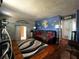 Cozy living room featuring a comfortable sofa, stylish decor, and warm hardwood flooring at 601 Berkshire Rd, Daytona Beach, FL 32114