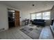 Sitting room featuring an exterior door, large windows, and a tile floor at 601 Berkshire Rd, Daytona Beach, FL 32114