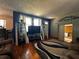 Comfortable living room featuring hardwood floors, stylish shelving, and a cozy seating area at 601 Berkshire Rd, Daytona Beach, FL 32114