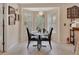 Sunlit breakfast nook with a charming round table and bay window view at 663 E Lansdowne Ave, Orange City, FL 32763