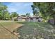 Charming single-story home with a two-car garage and a well-maintained front yard at 663 E Lansdowne Ave, Orange City, FL 32763