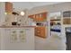 Functional kitchen with essential appliances and a breakfast bar, perfect for quick meals at 663 E Lansdowne Ave, Orange City, FL 32763