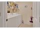 Laundry room with a white washer and dryer, wire shelf, and vinyl floors at 663 E Lansdowne Ave, Orange City, FL 32763