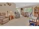 Spacious living area with a ceiling fan, tile floors and a combined dining area at 663 E Lansdowne Ave, Orange City, FL 32763