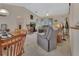 Cozy living room with vaulted ceilings and natural light, great for relaxation and entertainment at 663 E Lansdowne Ave, Orange City, FL 32763
