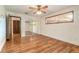 Bedroom featuring a window, wood floors, closet, and ceiling fan at 712 S Timberlane Dr, New Smyrna Beach, FL 32168