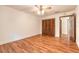 Bedroom featuring wood floors, a closet, and a ceiling fan at 712 S Timberlane Dr, New Smyrna Beach, FL 32168