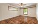Bedroom featuring hardwood floors, white walls, and a ceiling fan at 712 S Timberlane Dr, New Smyrna Beach, FL 32168